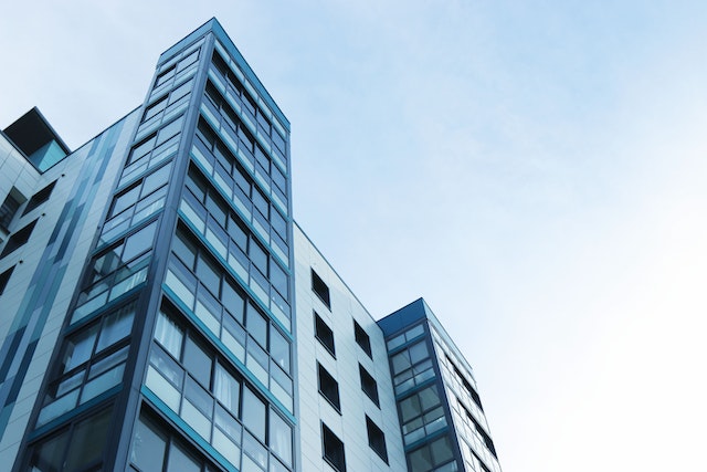 tall apartment building with large glass windows